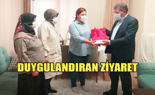 BAŞKAN EMİNMOLLAOĞLU, ŞEHİT EŞİNE BAYRAK HEDİYE ETTİ